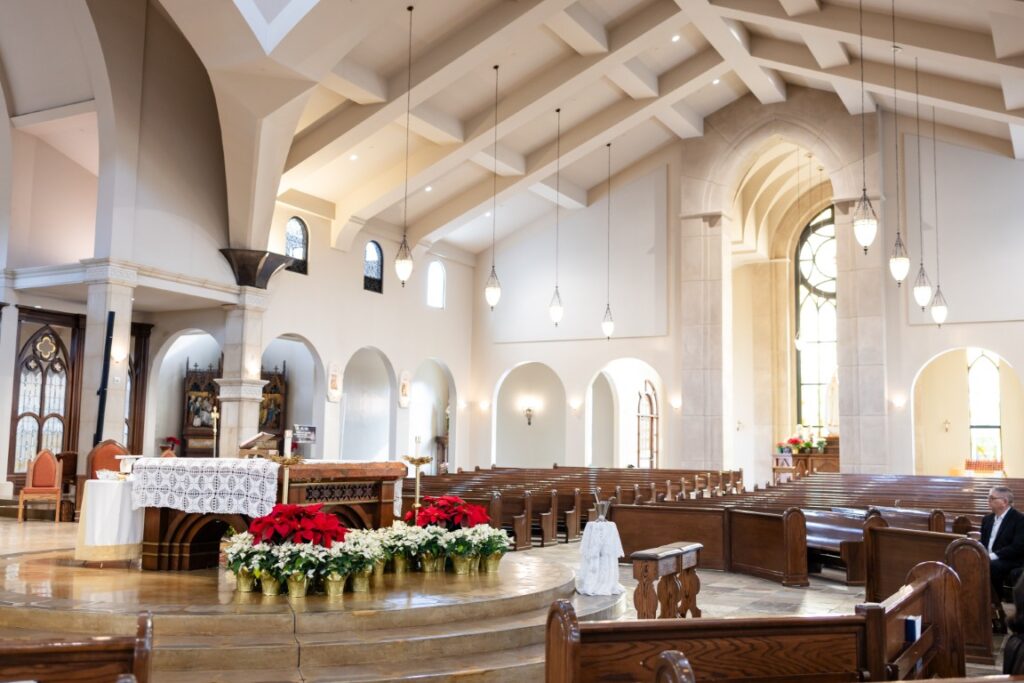 St. Stanislaus Church altar with crucifix and tabernacle in view before the California Catholic Wedding.