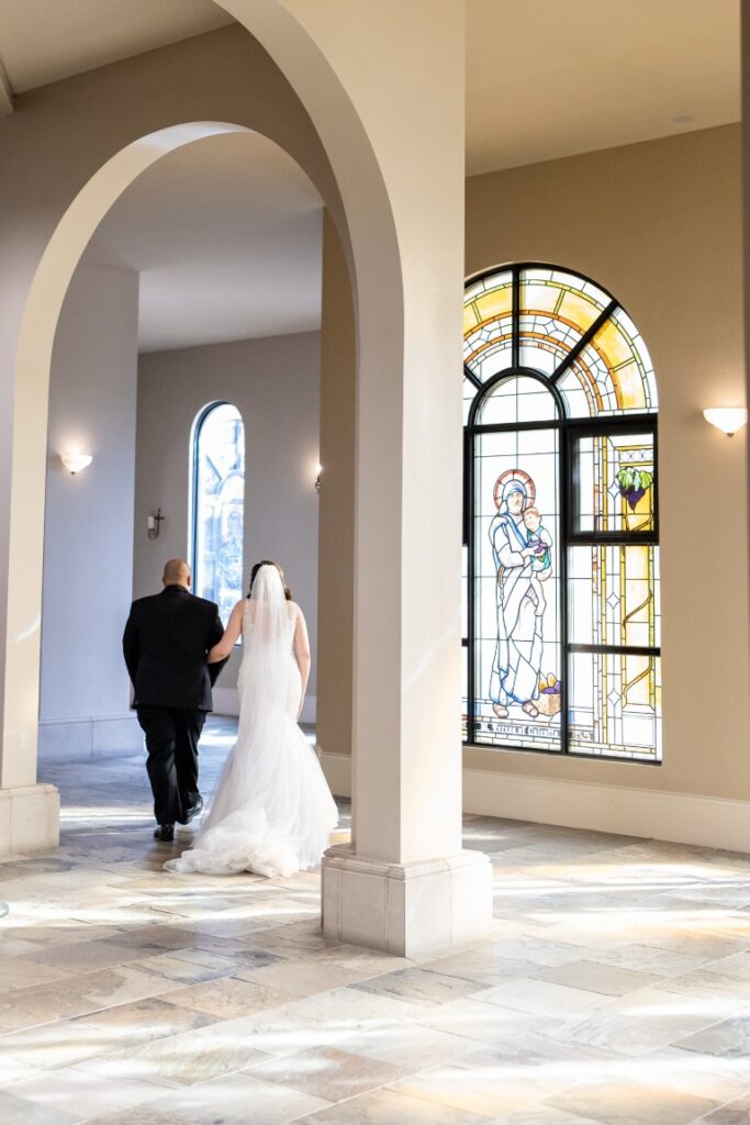 Catholic Bride and groom walking through the Church.